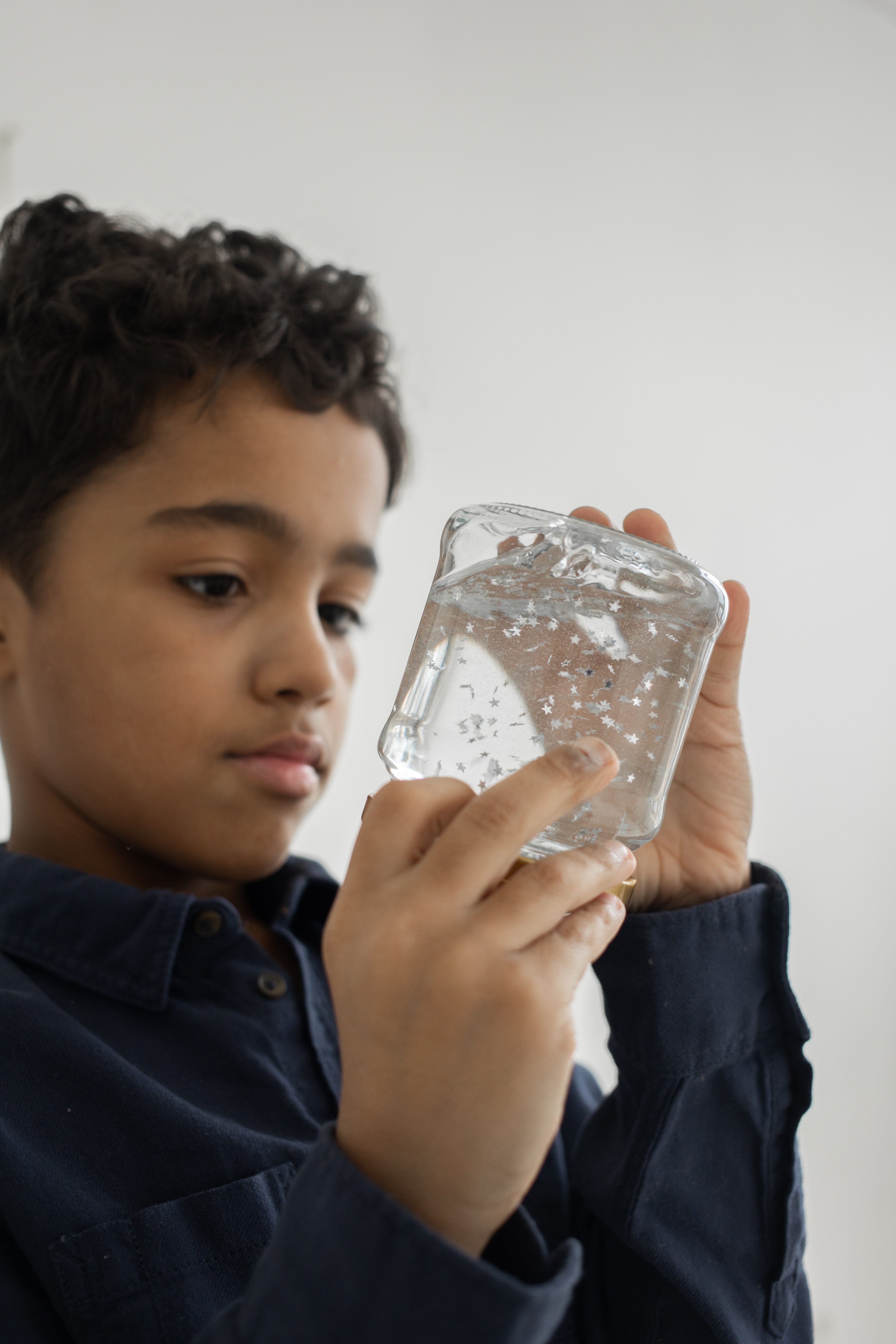 boy looking at bottle